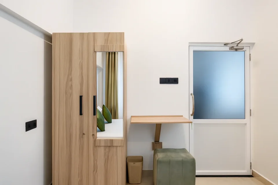 Wooden wardrobe and dressing table in a Katunayaka ground-floor bedroom