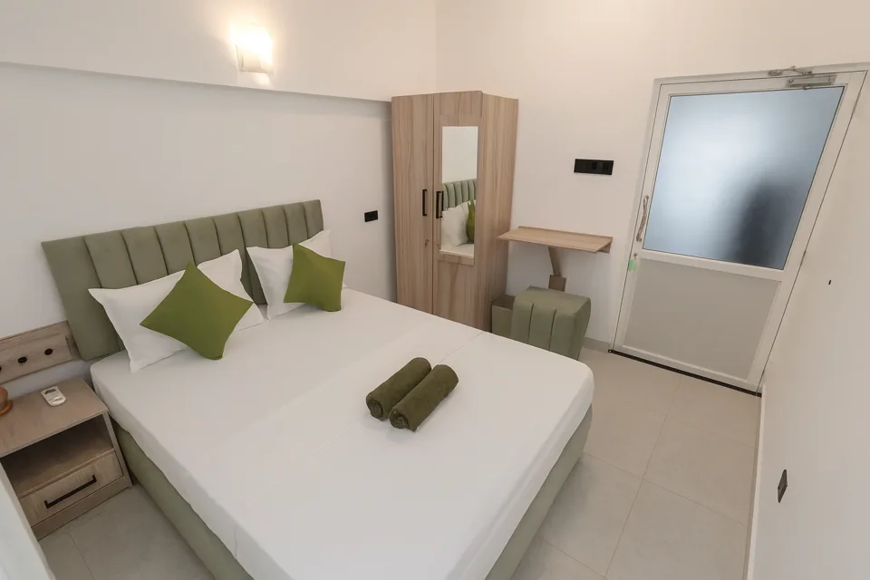 Katunayaka ground-floor bedroom showing the bed, wardrobe and dressing table